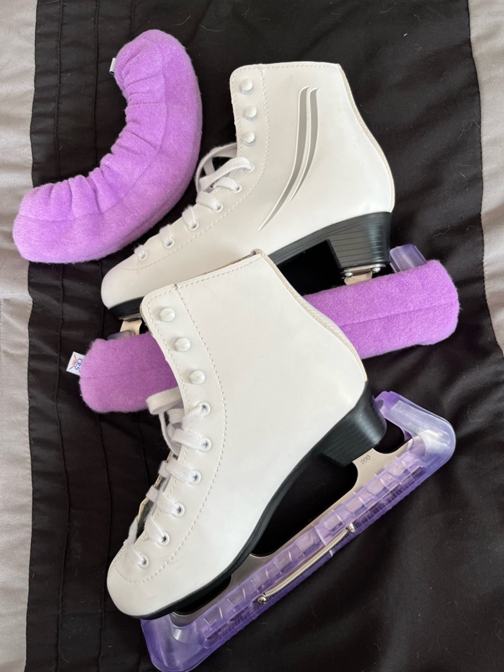 White Girls Ice Skates with Purple Blade Covers Makes a perfect gift